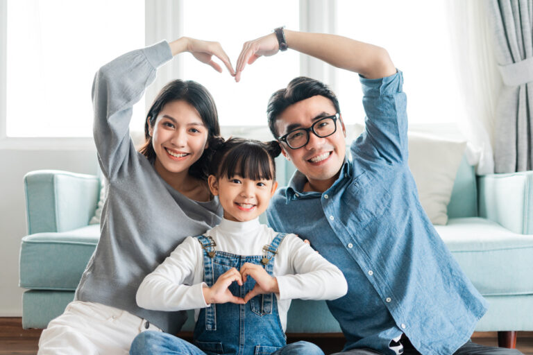 small asian family portrait at home